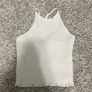 White kind of crop top, worn twice, ( once in family photos )